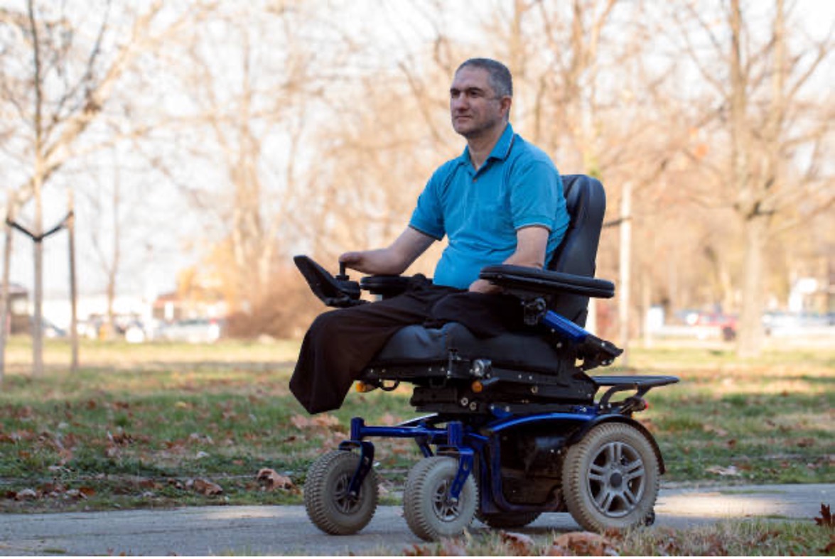 A male powered wheelchair user